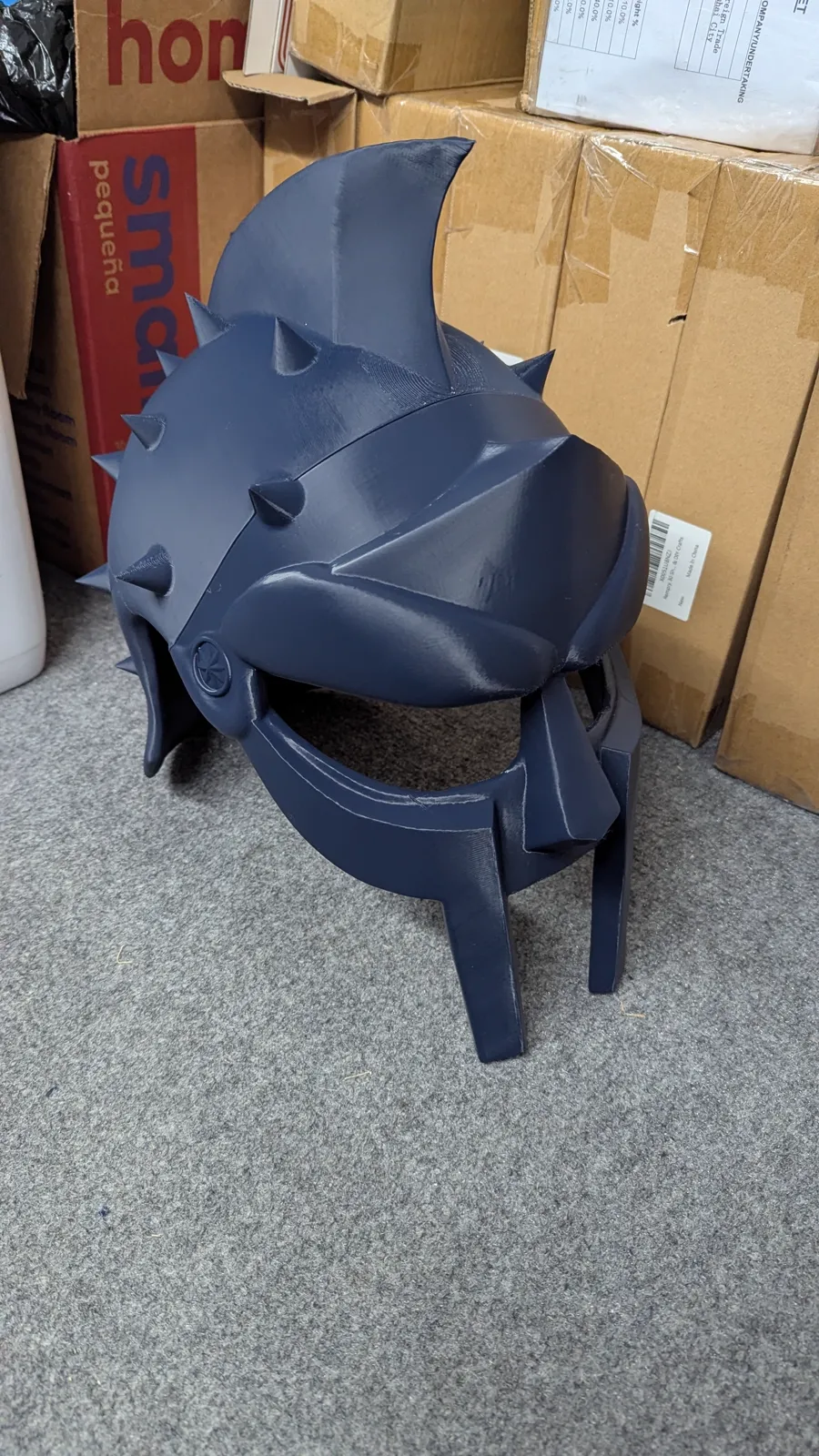 Filament (FDM) 3D printing by Kulworks: a full-size gladiator helmet and prop armour, articulated figures, terrain and city pieces, game markers, functional parts, and full runs of custom awards.