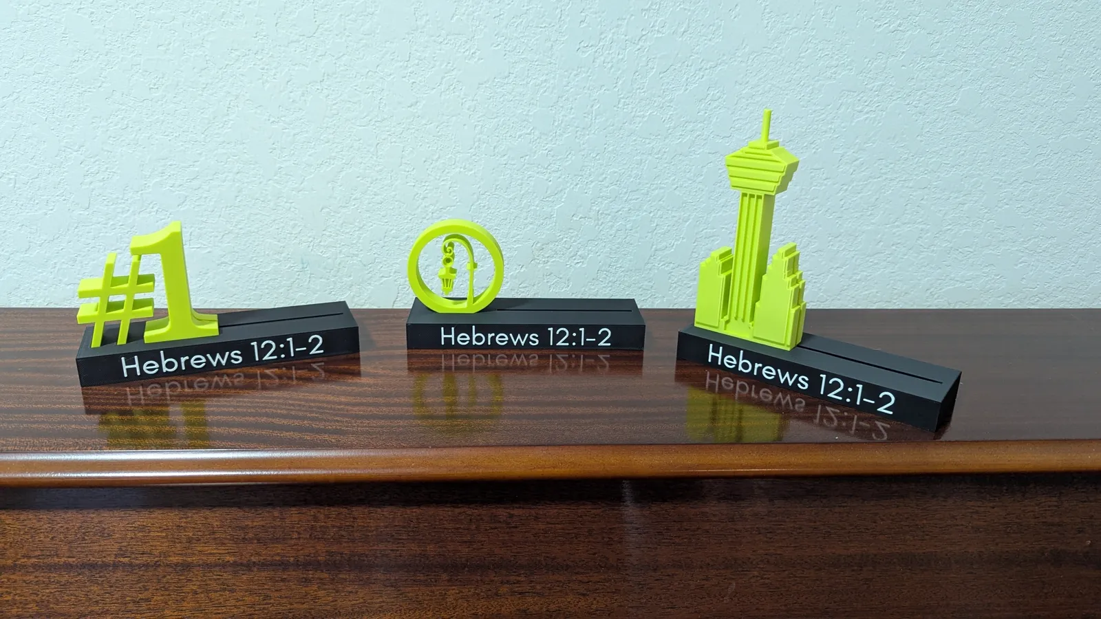 Custom 3D models designed in Shapr3D: award designs modeled from scratch, client logos built as 3D artwork for Bulverde Astros and Bomber Bees, and character models.